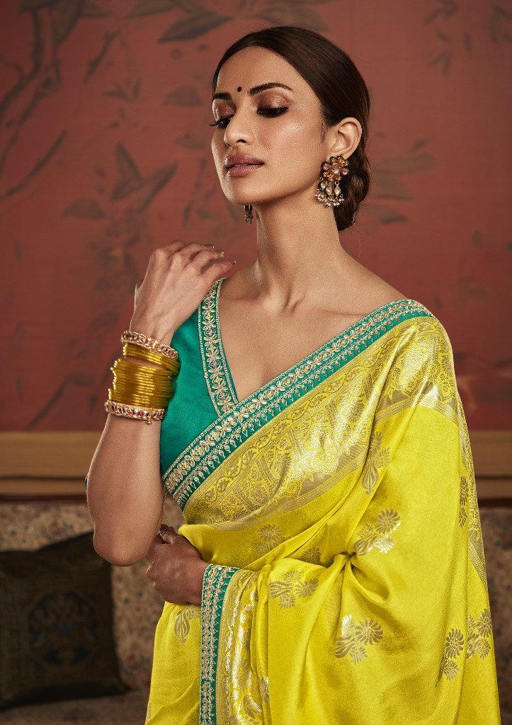Sunny Radiance: Yellow Dola Silk Saree with Intricate Zari Weaving and Green Blouse